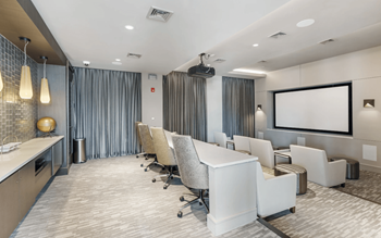 Private media room featuring surround-sound and stadium seating